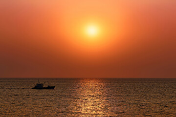 A magical bright orange sunset over the sea
