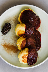 Cheesecakes with jam on a plate close-up. Pancakes with jam on a plate.