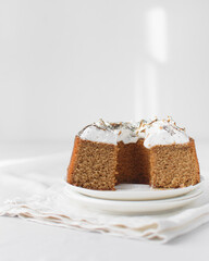 Sliced homemade bundt cake with a toasted meringue topping