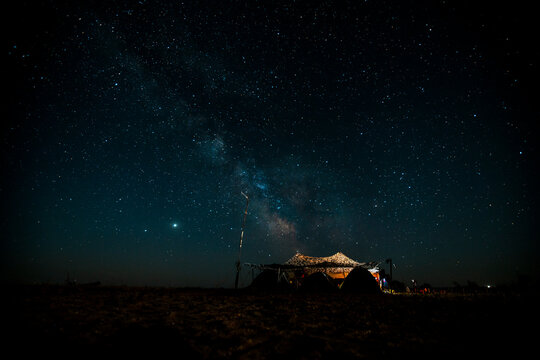 tent against the backdrop of a beautiful starry sky