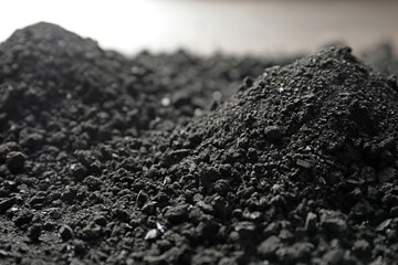 Heap of black coal, closeup view. Mineral deposits