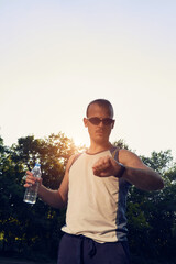 Fototapeta premium Sporty young adult man training in the park.