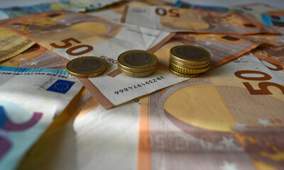 Background of euro notes and coins symbol of the European economy.