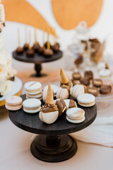 Fresh macaroons dessert on a sweet table.