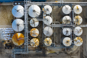 Aerial view of a petrol chemical processing plant and storage facilities in Chicago, IL in early morning light.
