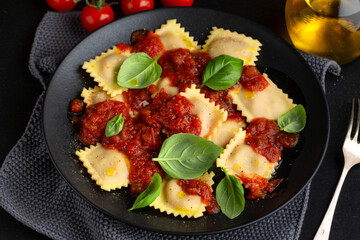 Ravioli with tomato sauce on plate