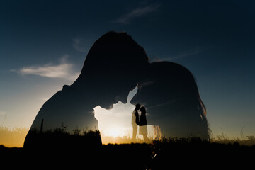 Silhouette of a woman and a man at sunset. Multiple exposure of a man and a woman in nature.