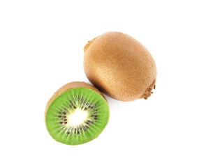 Obraz premium Cut and whole fresh kiwis on white background, top view
