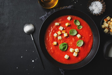 Creamy tomato soup served in bowl
