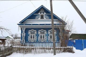 Vintage wooden rural house in Sudislavl town, Kostroma region, Russia. Building facade, ornamental...