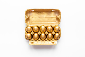 Golden Easter eggs in box cells. Save money. Symbol of wealth and good luck