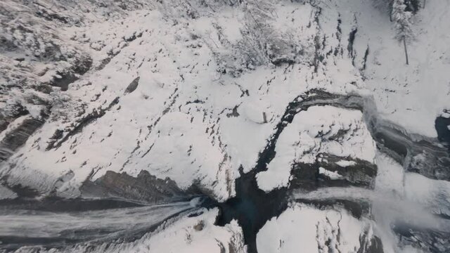 Cold Water Running Down On Cascade du Rouget During Winter In Sixt-Fer-a-Cheval, France. - FPV, spin