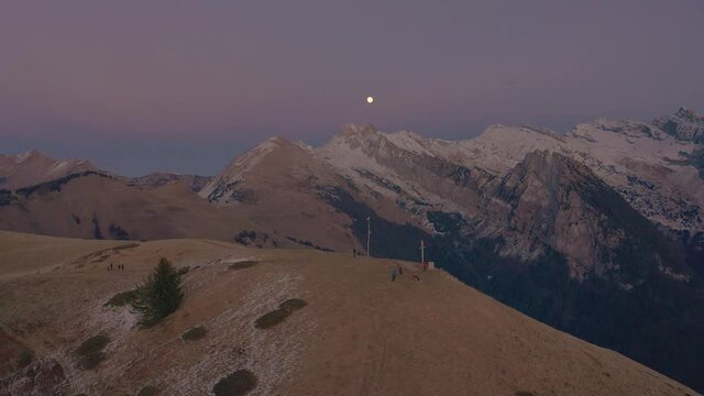 Paragliders At The Peak Of Le Brevent In Chamonix, Haute Savoie, France With Panoramic View Of Mont Blanc In Background. aerial drone, panning shot