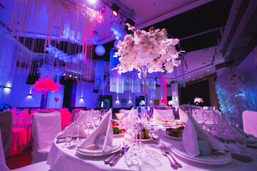 A Grand restaurant and a ballroom in a luxury hotel. The interior design is executed in classical...