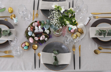 Beautiful Easter table setting with festive decor, flat lay