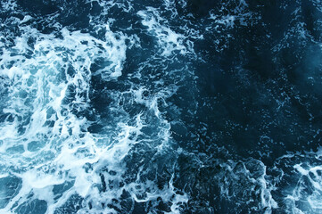 Abstract blue sea water with white wave