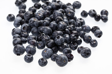 fresh blueberries spread on white surface 