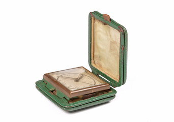 Old green folding travel alarm clock