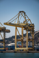 Fototapeta na wymiar Barcelona, Spain; December 5, 2020: Large crane of the port of barcelona, ​​loading of ships with containers 