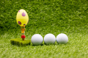 Golf Easter Holiday with eggs and golf ball on green grass