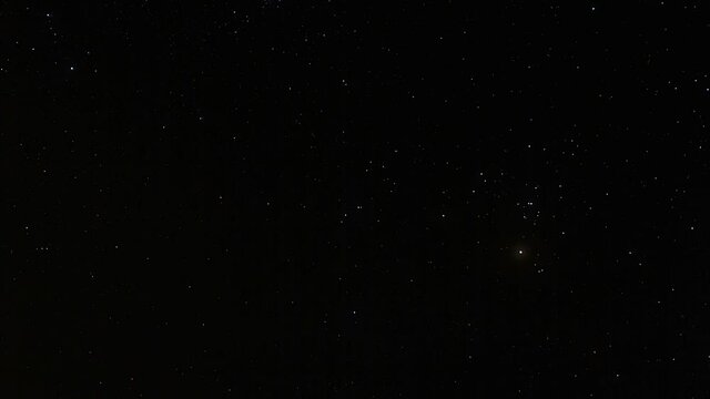Timelapse of stars moving in night sky, starry sky turning around the Earth