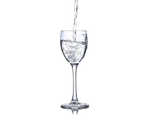 Wine glass with splashes of fresh water drops