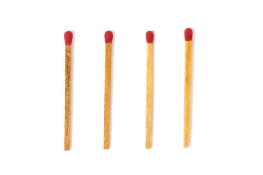 A set of four stick of new unused wood matchstick with red color potassium chlorate head at the tip (top) of match for lighting a fire isolated in white background.