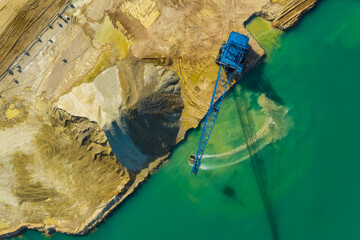 Aerial view of a blue crane operating on a quarry in Blackberry Township in Illinois, United States of America.