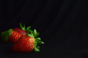 strawberries on a black background