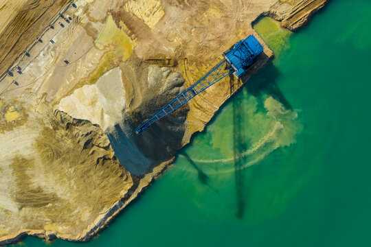 Aerial view of a blue crane operating on a quarry in Blackberry Township in Illinois, United States of America.