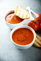 Homemade spicy tomato soup with grilled bread