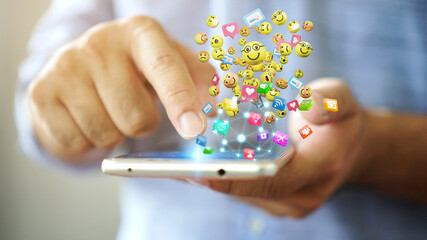 Man using smartphone sending text messages emoticon icons. Social network concept, 3d rendering
