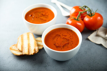 Homemade spicy tomato soup with grilled bread