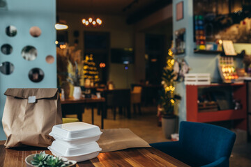 take away food, prepared for delivery on table in restaurant
