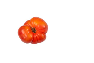 Ugly funny ripe tomato on a white isolated background. Copy space. horizontal