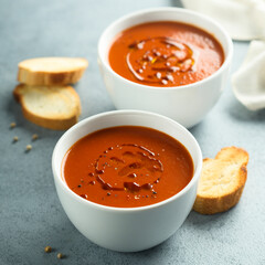 Homemade spicy tomato soup with grilled bread