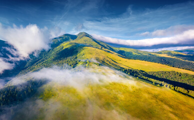Aerial landscape photography. Breathtaking morning view from flying drone of Breska valley....
