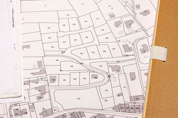 Fototapeta premium Urbanisme et logement - Aménagement du territoire - projet de lotissement sur fond de plan cadastral