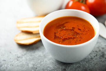 Homemade spicy tomato soup with grilled bread