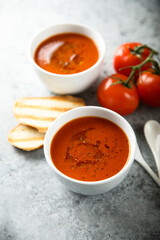 Homemade spicy tomato soup with grilled bread