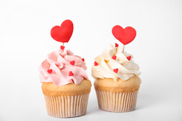 Tasty cupcakes for Valentine's Day on white background