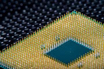 Close-up of a part of a microprocessor in soft focus under high magnification. Details of a computer component under a microscope.