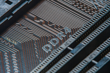 High tech dark background with elements of a computer motherboard in soft focus under high...