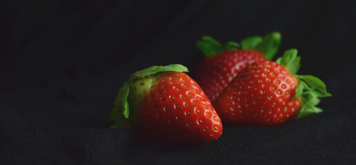 strawberries on a black background