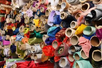 Various rolls of fabric in shop