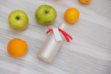 image of homemade cosmetics ingredients. aroma theme. organic cosmetics with extracts of herbs apples, lemons and oranges on white background