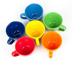 Multi-colored coffee cups on white