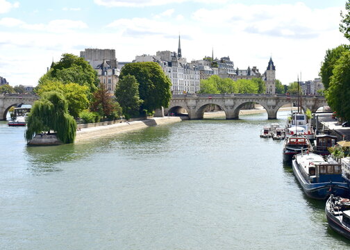 View of Seine River, Pont Neuf, Ile de la Cite and Square du Vert-Galant from Pont des Arts. Paris, France.