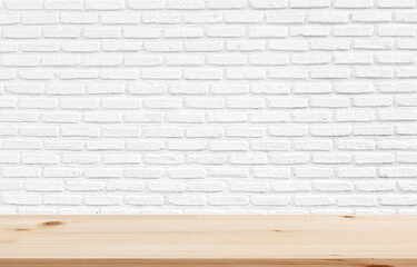 Wooden table with white brick wall. Use as montage for product display