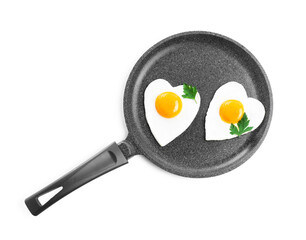 Romantic breakfast with fried heart shaped eggs isolated on white, top view. Valentine's day celebration